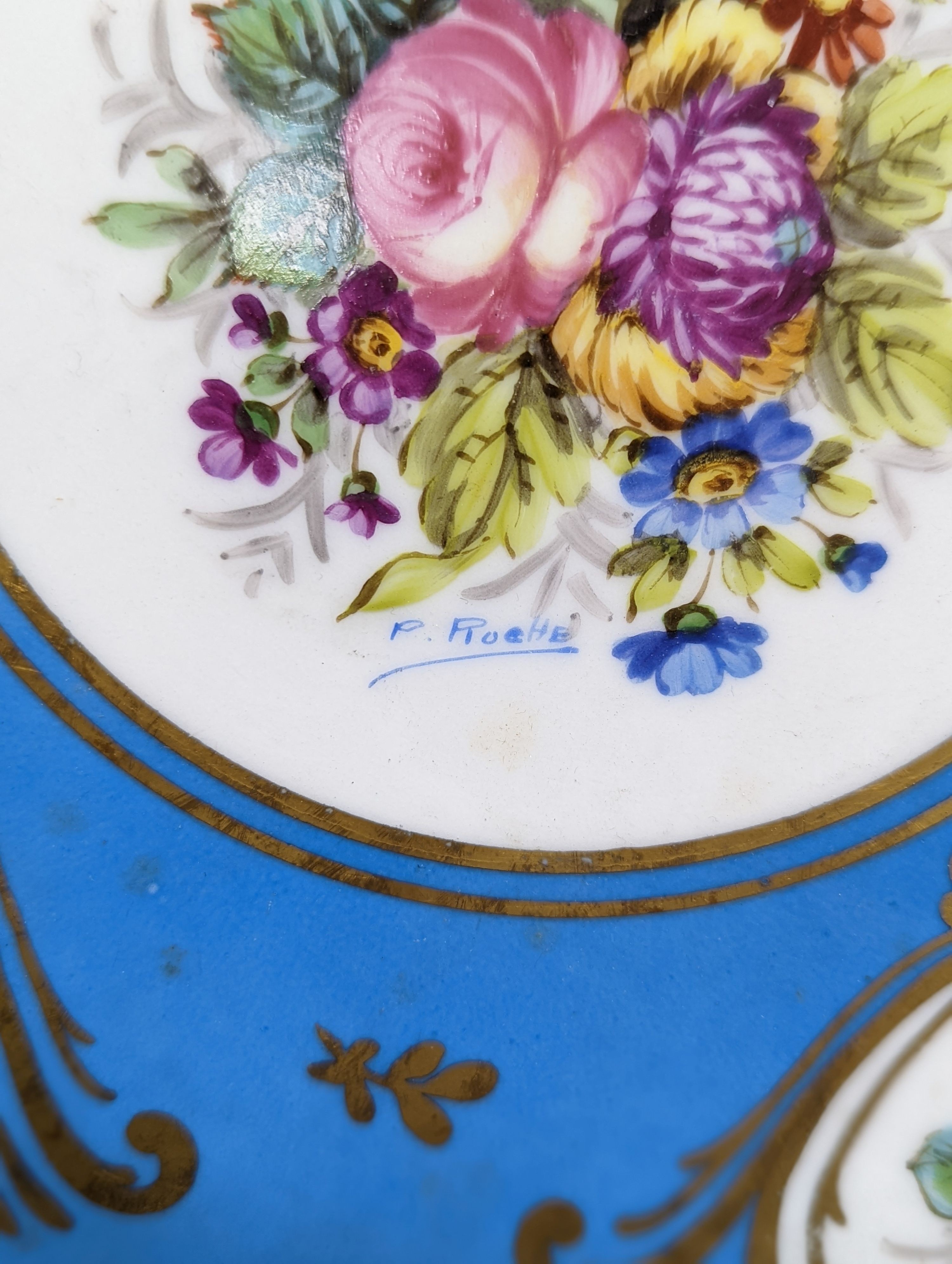 A Sevres style boat shaped dish and a Limoges circular dish, Sevres dish 27 cms wide & Limoges dish 31 cms diameter.